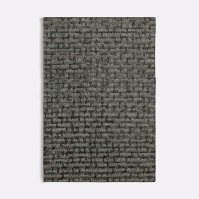 Muted green-grey woven swatch with a dense small-scale maze-like geometric motif