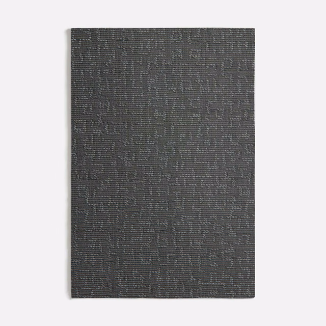 Deep charcoal grey woven swatch with subtle broken linear texture