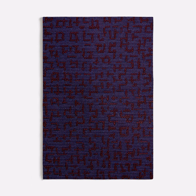 Deep blue-purple woven swatch with burgundy irregular geometric marks and subtle horizontal texture