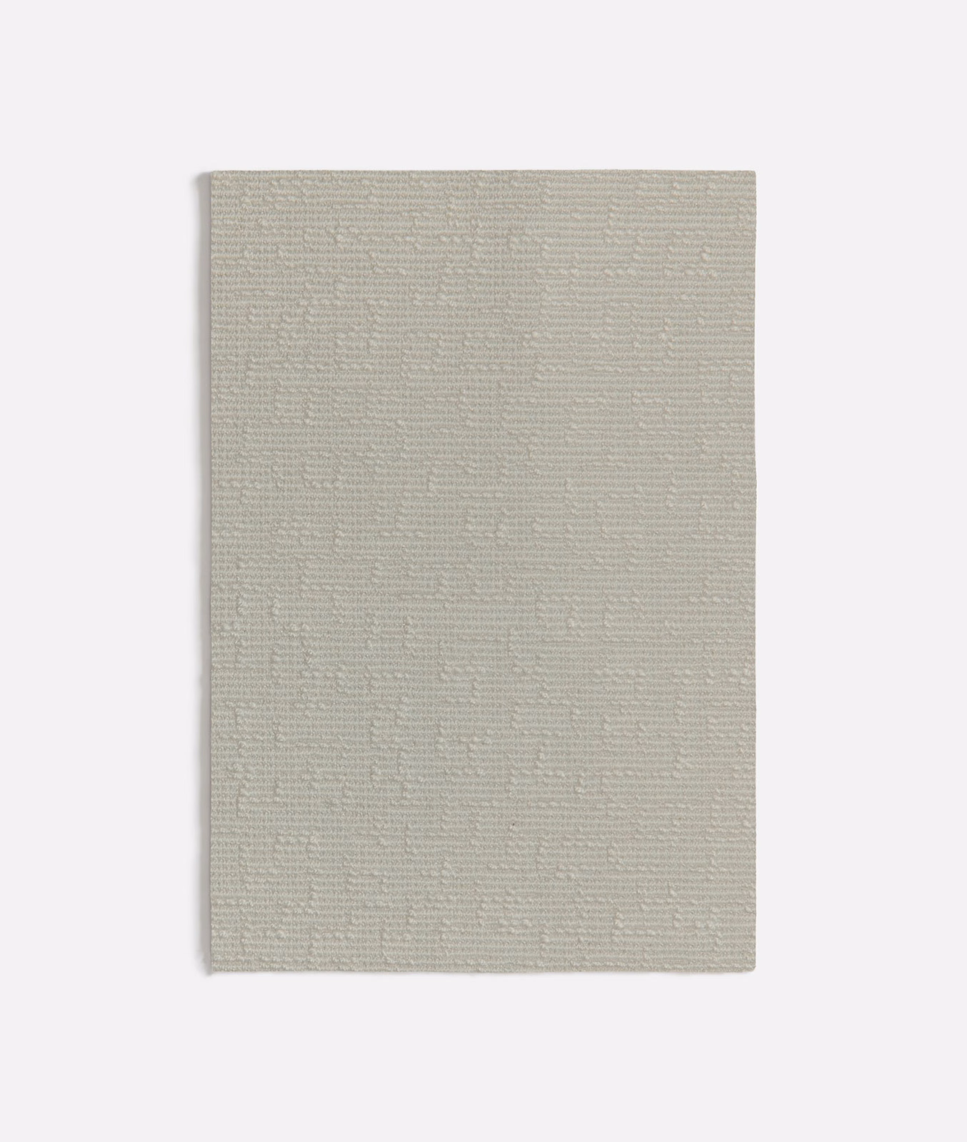 Pale warm-white fabric swatch with fine broken horizontal texture and soft greige depth
