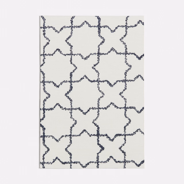 Ivory textile with irregular ink-blue star-and-cross lattice and fine horizontal texture