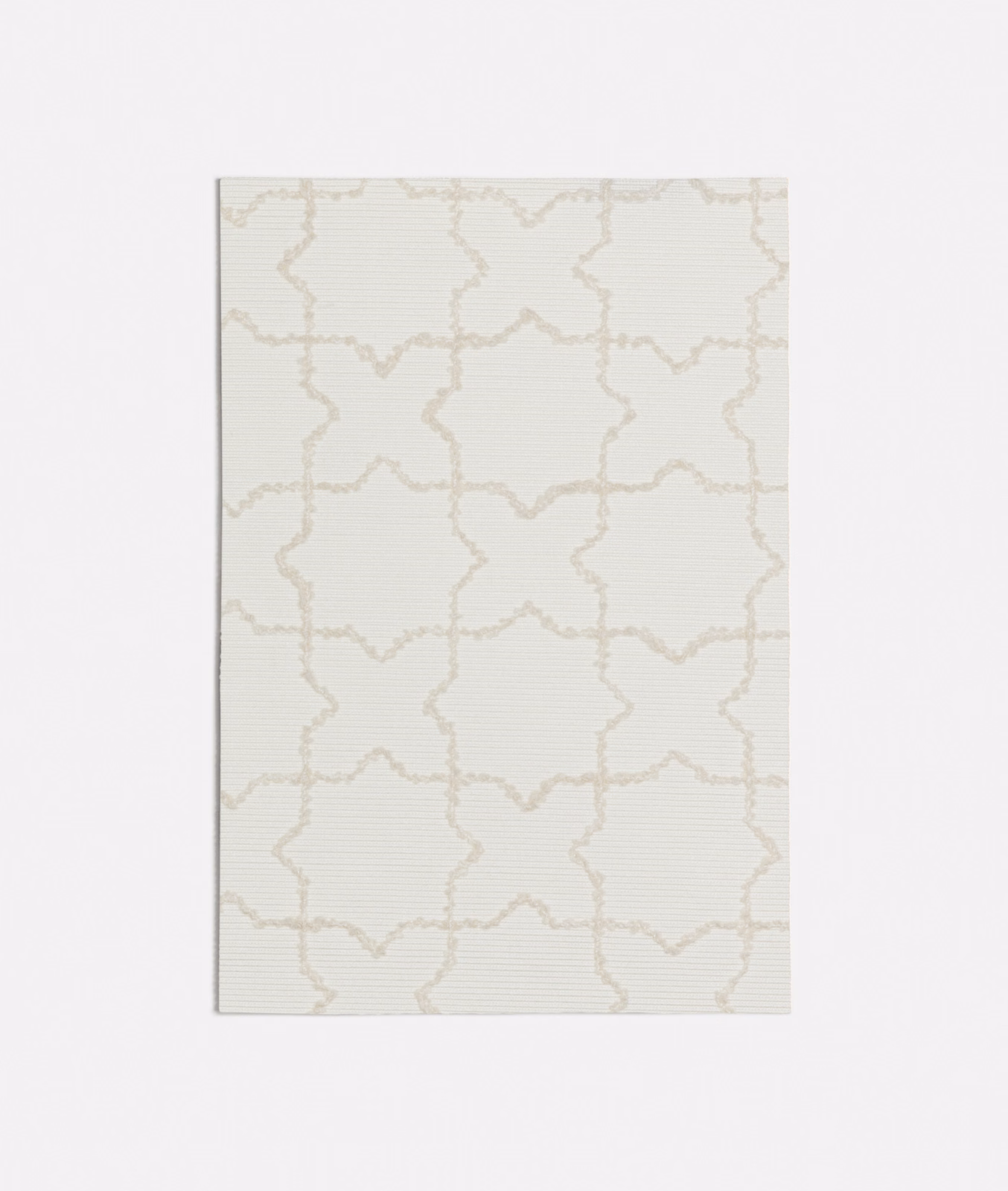 Pale ivory woven fabric with fine taupe star-and-cross lattice