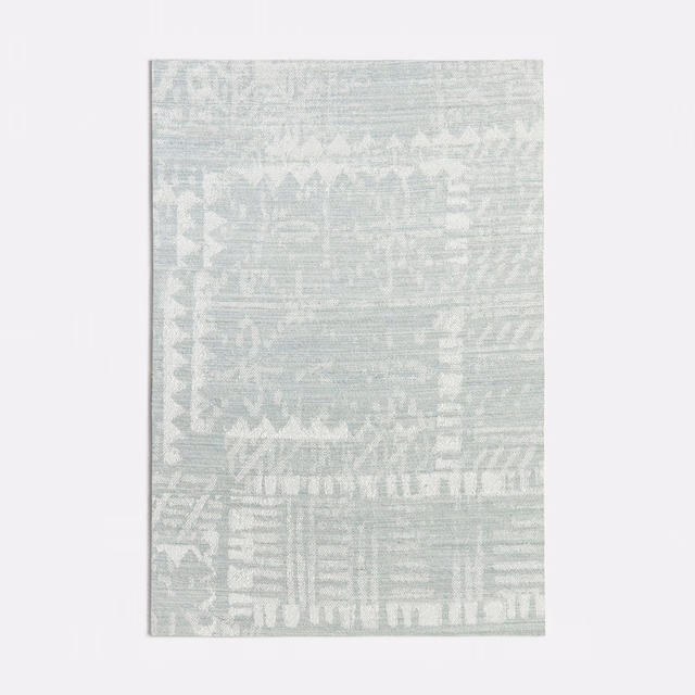 Pale seafoam textile with distressed geometric bands and softly striated woven texture
