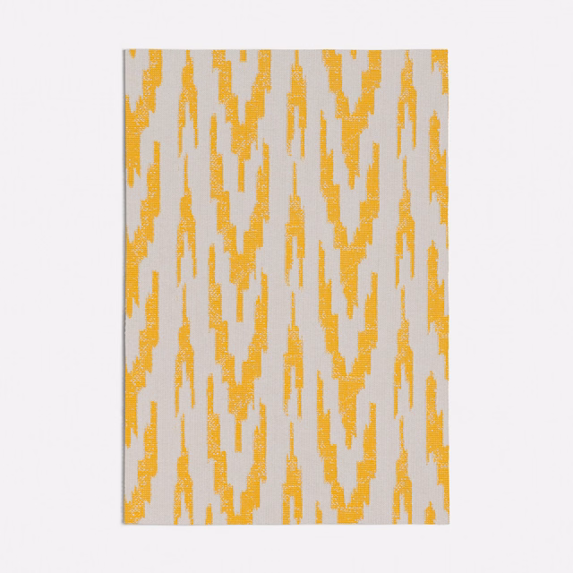 Ochre-yellow broken ikat stripes on a pale grey textured woven ground