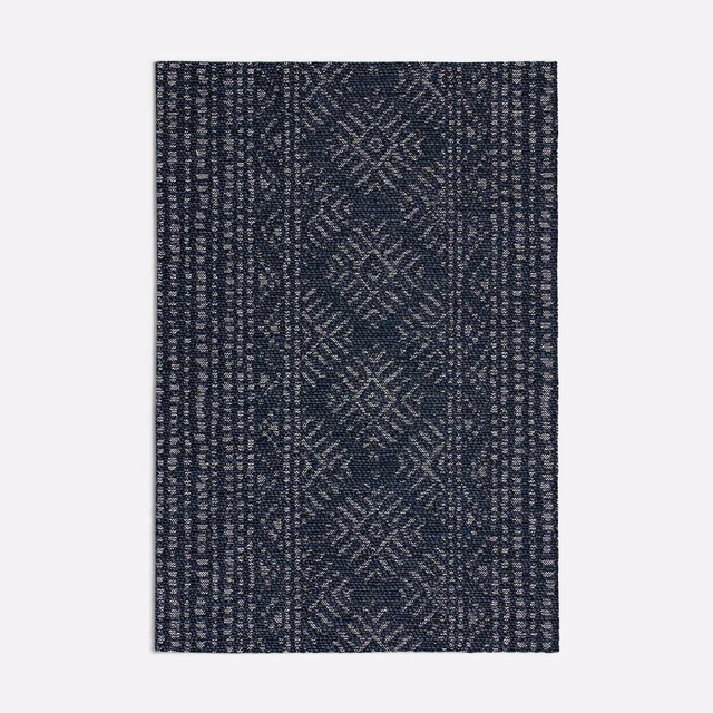 Deep navy woven swatch with pale geometric diamonds and textured vertical borders
