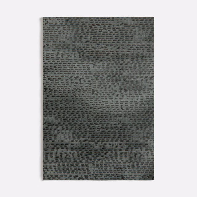 Muted green-grey swatch with dense horizontal ridges and softly mottled texture