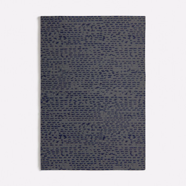 Slate-grey woven fabric with irregular navy horizontal dashes and tactile texture