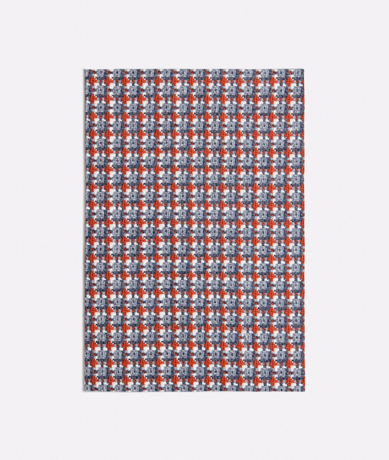 Kasimiro Blue textile with dense blue-grey checks and rust-red geometric accents
