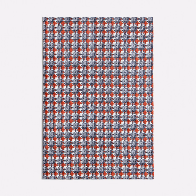 Kasimiro Blue textile with dense blue-grey checks and rust-red geometric accents