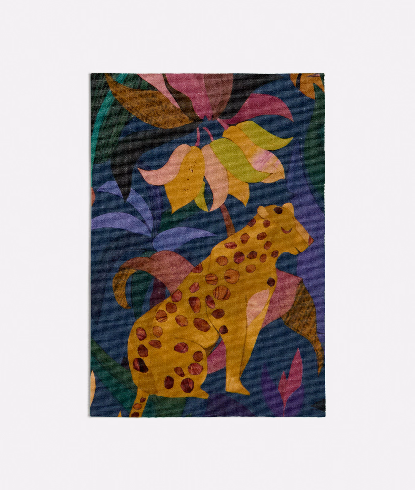 Deep blue woven swatch with a spotted giraffe and jewel-toned botanical motifs