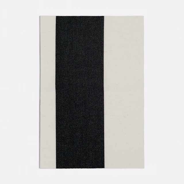Black central stripe flanked by ivory bands in a fine woven textile