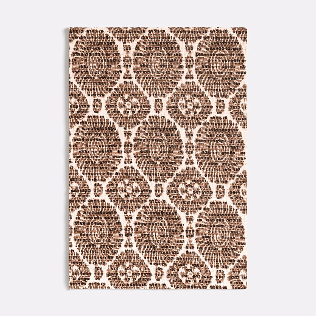 Warm cocoa medallions and rosettes on an ivory textured fabric swatch