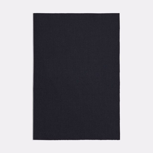 Near-black lapis blue textile with a fine, barely visible woven surface