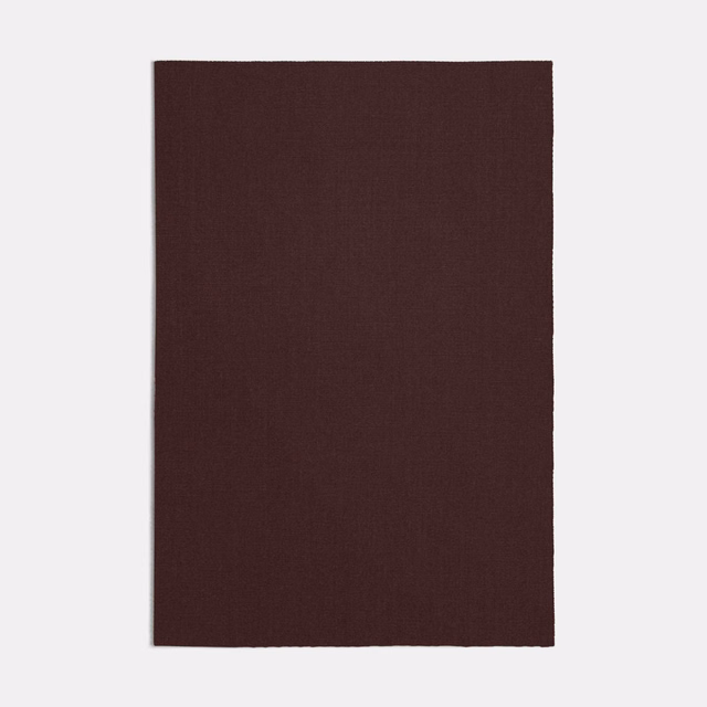 Close view of deep bordeaux plain weave with subtly textured surface