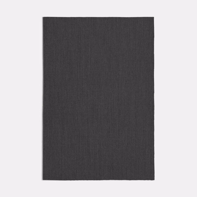 Dark charcoal-grey textile with fine vertical striations and a subtly tactile surface