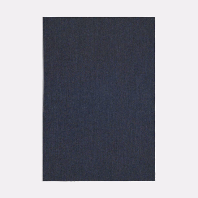Dark lapis-blue woven swatch with fine, subtly vertical texture