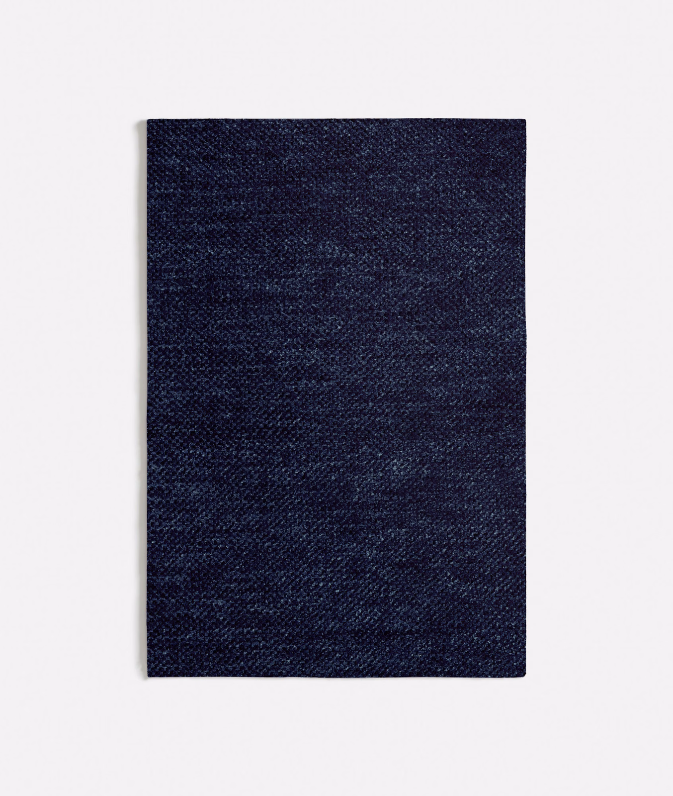 Close view of Lucrezia Blue’s dark navy mottled weave with fine blue variation