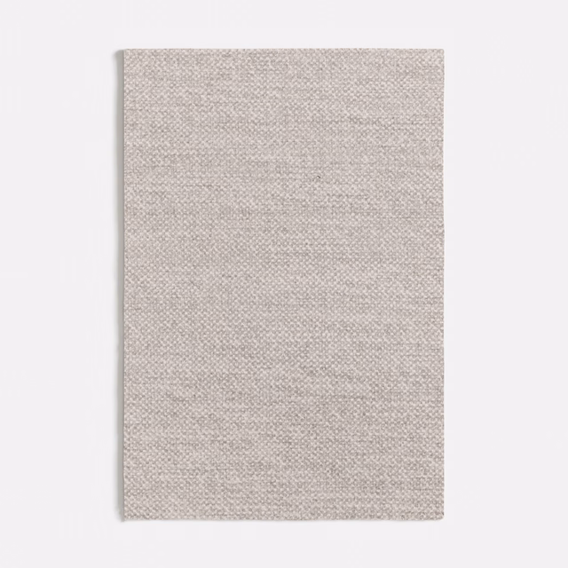 Pale greige-grey fabric swatch with a fine, subtly flecked woven texture