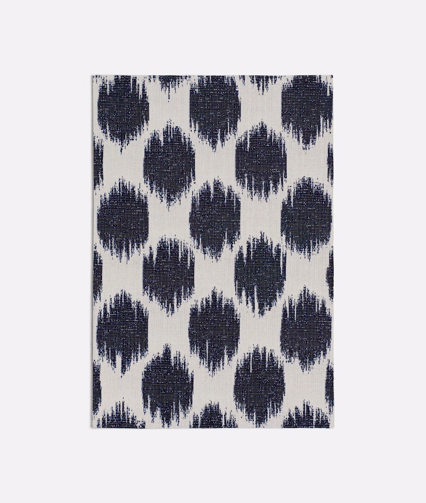 Ivory woven fabric with repeating deep ink-blue frayed diamond motifs