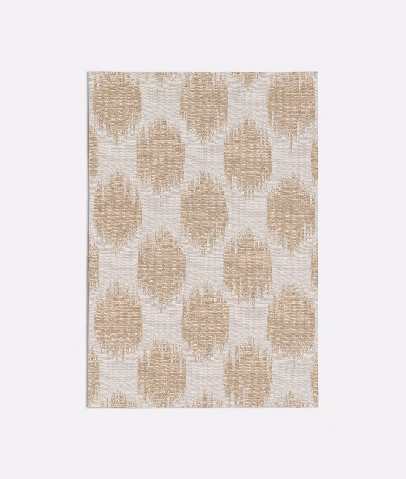 Warm oat beige and ivory textile with irregular brushed ikat-style motifs