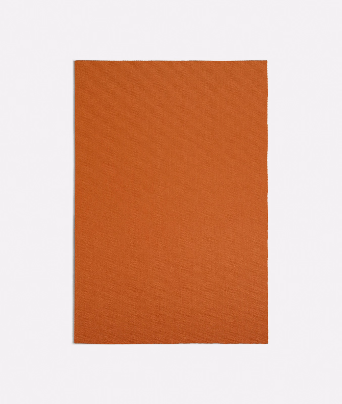 Burnt-orange plain weave swatch with a fine, subtly vertical textile grain
