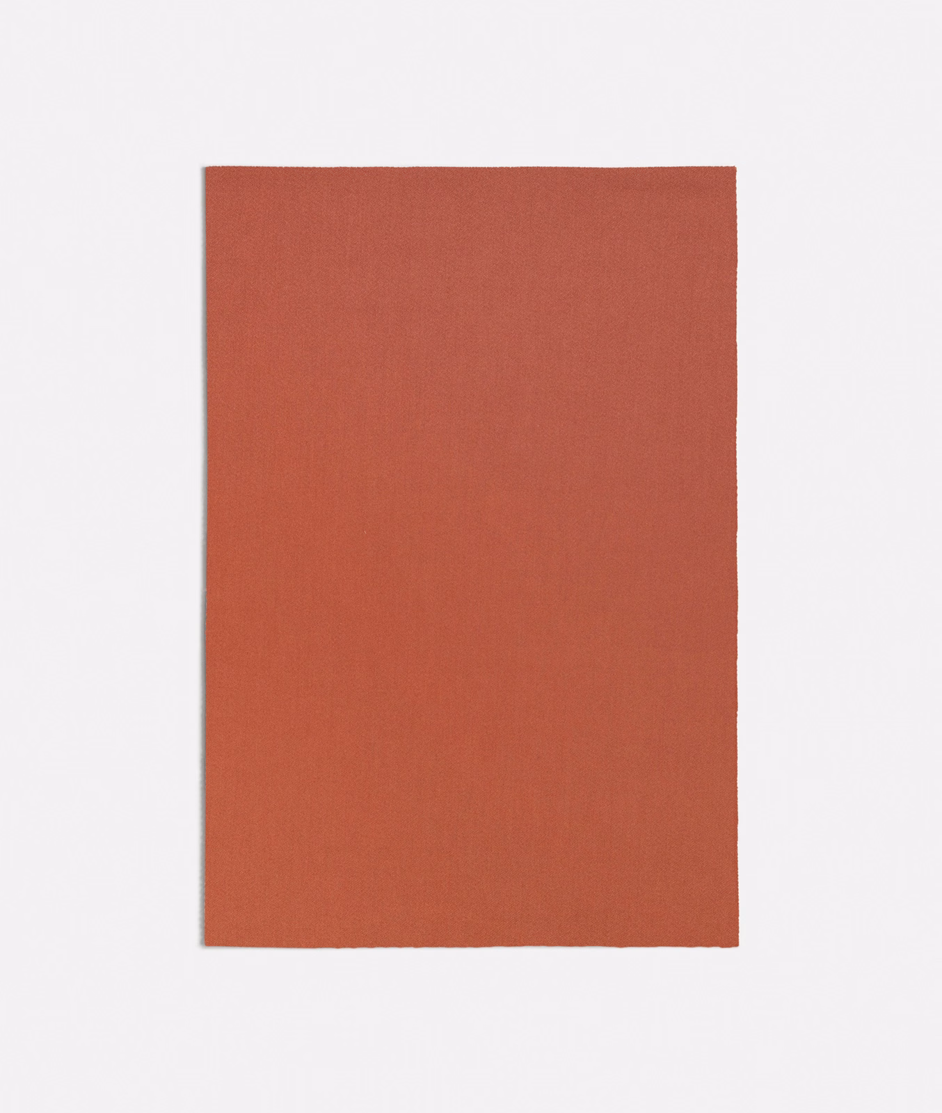 Warm terracotta plain-weave swatch with a fine, subtly vertical surface texture