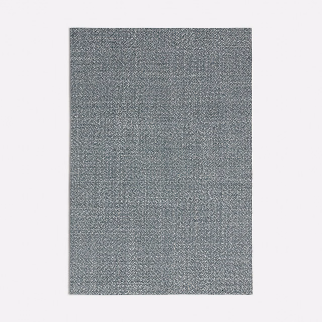 Close-up of muted seafoam-grey woven fabric with a fine mottled texture