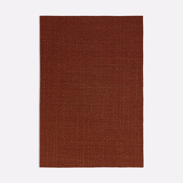 Deep russet terracotta fabric swatch with a fine, subtly textured woven surface