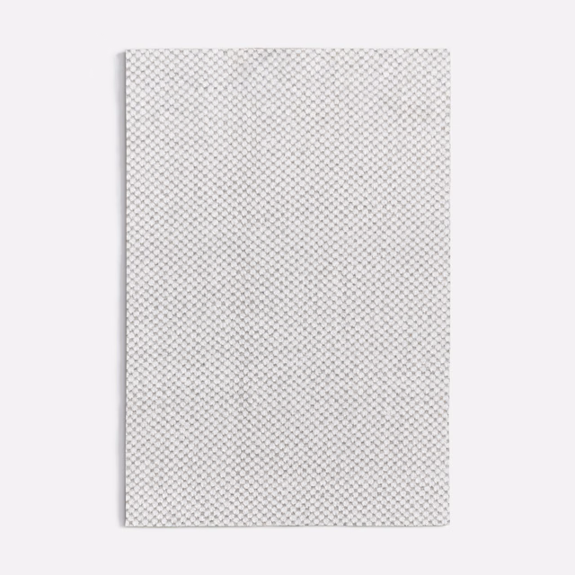 Pale cool grey textile swatch with a tightly repeated tiny diamond lattice