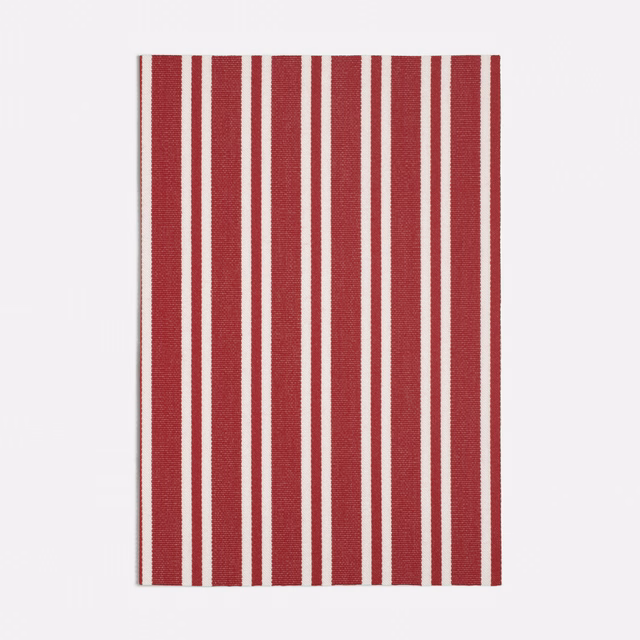 Deep garnet-red and ivory vertical stripe fabric with a fine woven surface