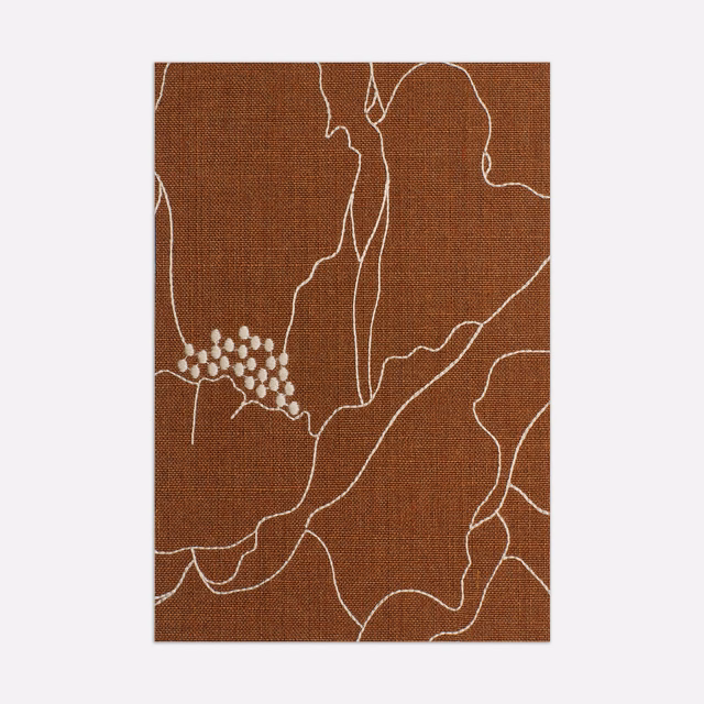 Warm terracotta woven swatch with ivory abstract contours and a small dotted cluster