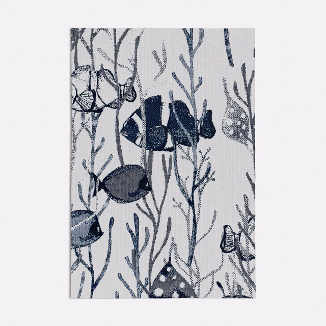 Ivory-grey textile with navy fish, branching seaweed and fine woven texture