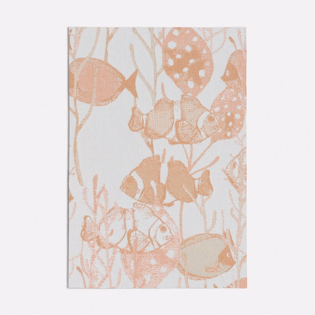 Peach woven textile with coral fish, bubbles and branching aquatic motifs