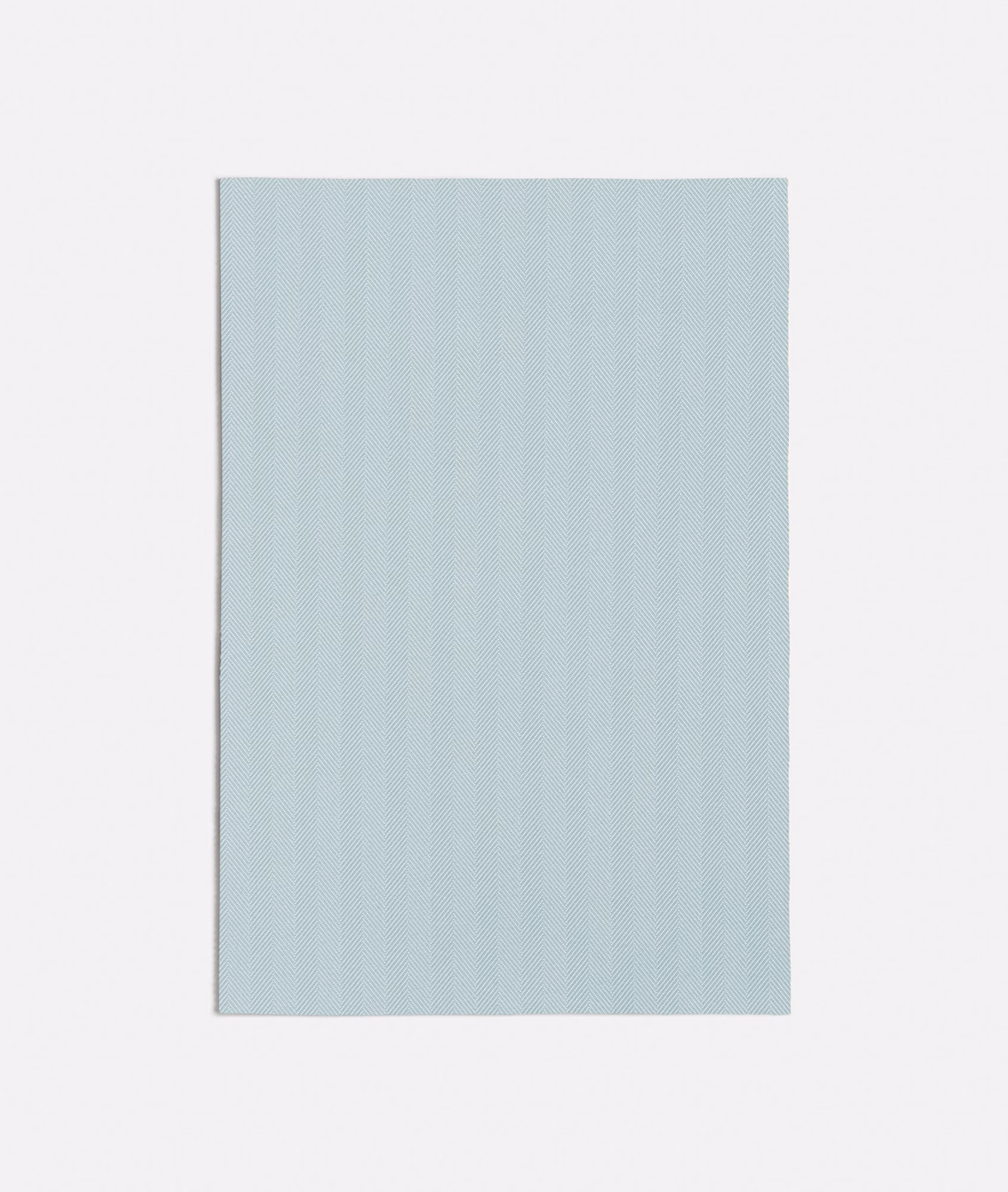Pale icy blue fabric swatch with fine vertical woven striations and a softly chalky surface