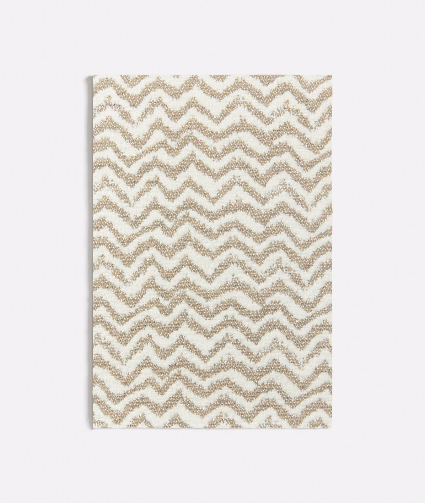 Warm beige and cream woven textile with irregular zigzag chevron bands
