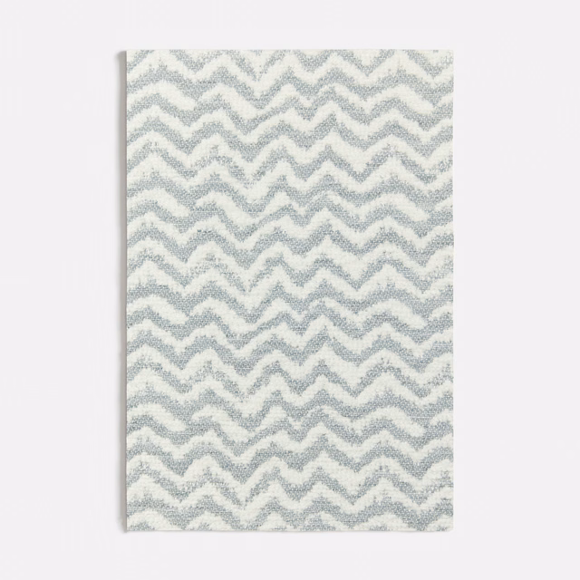 Pale seafoam and ivory woven fabric with a compact, tactile zigzag pattern