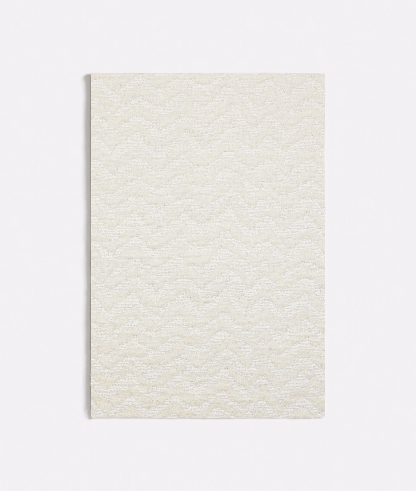 Ivory white fabric with a softly raised, repeating wave texture