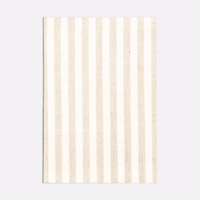 Warm ivory fabric with finely textured vertical beige stripes