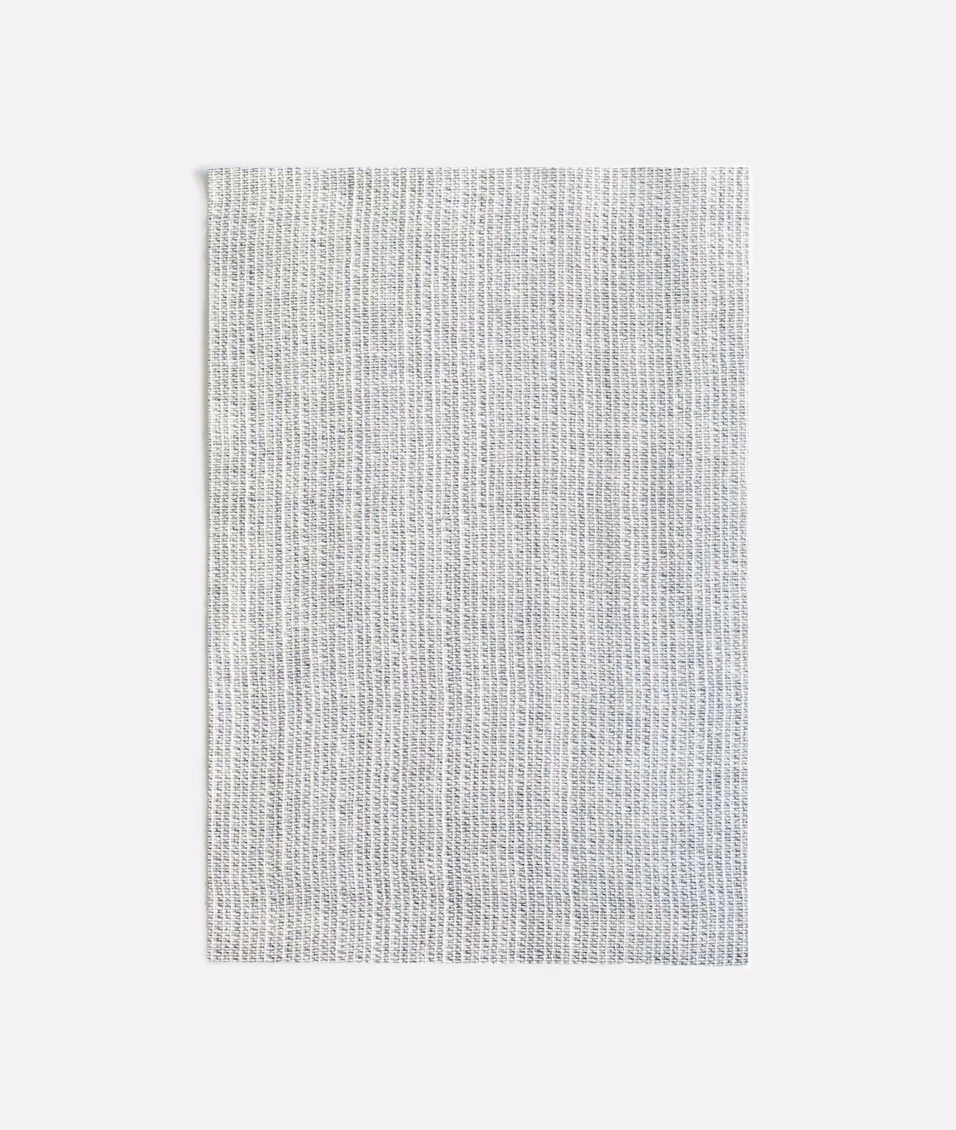 Cool pale-grey woven swatch with fine vertical ribs and subtle slub texture