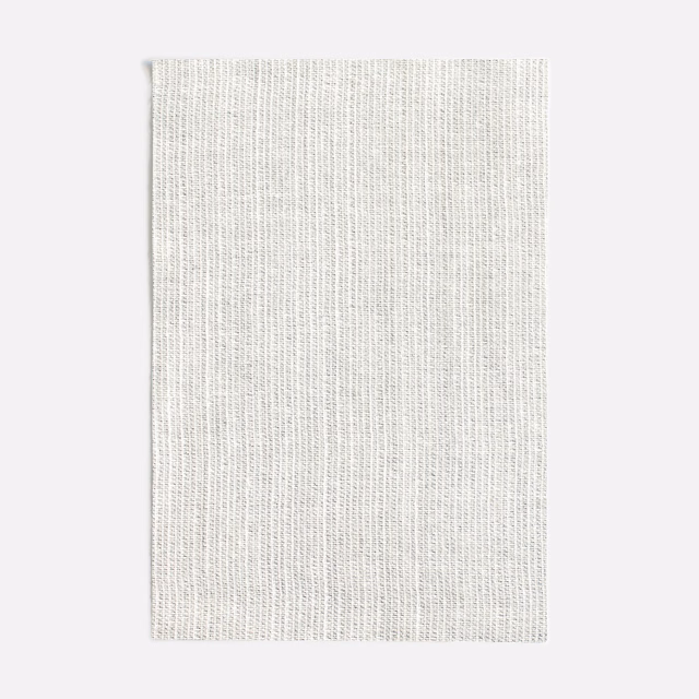Cool pale grey fabric with a fine vertical weave and softly flecked texture