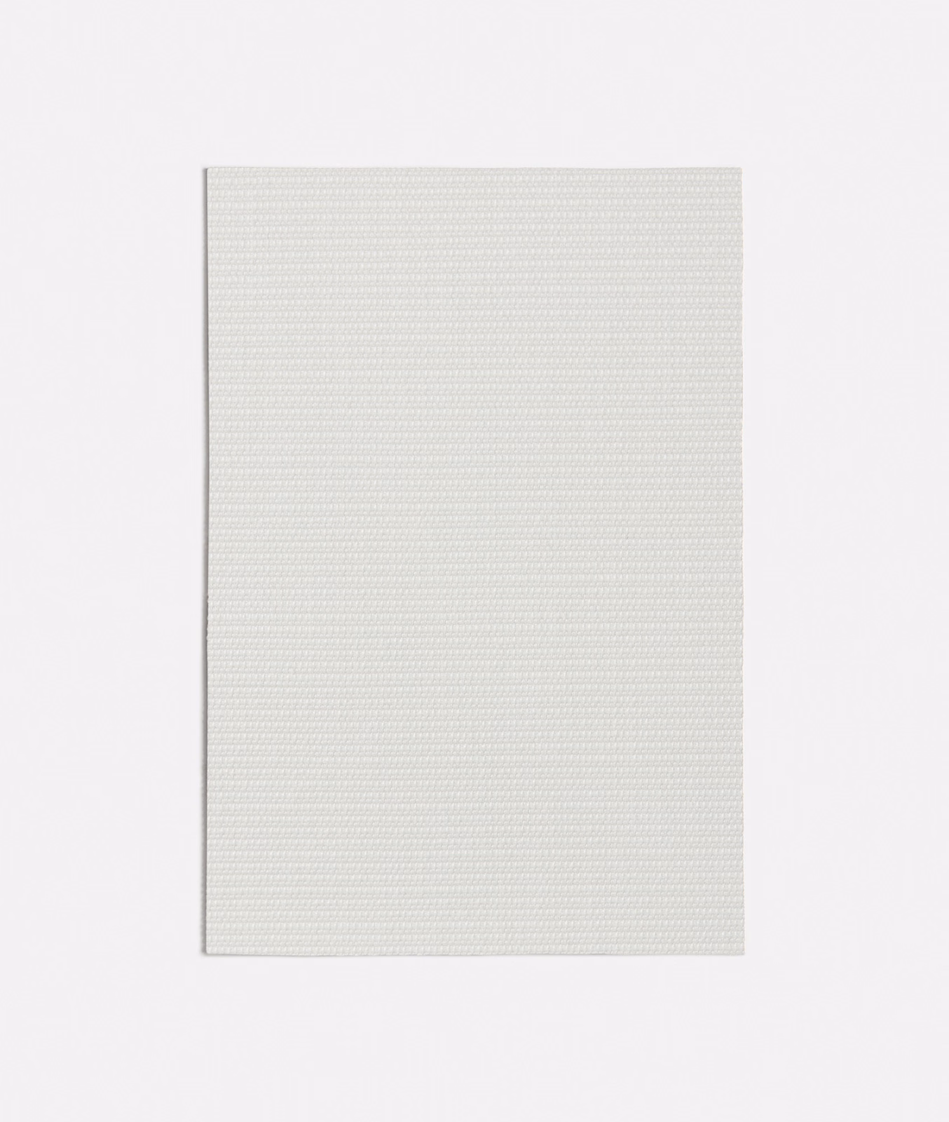Close-up of pale grey-white fabric with a fine, even basket weave