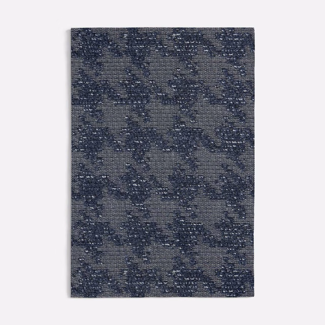 Blue-grey pied-de-poule weave with navy flecks and a tactile textured surface