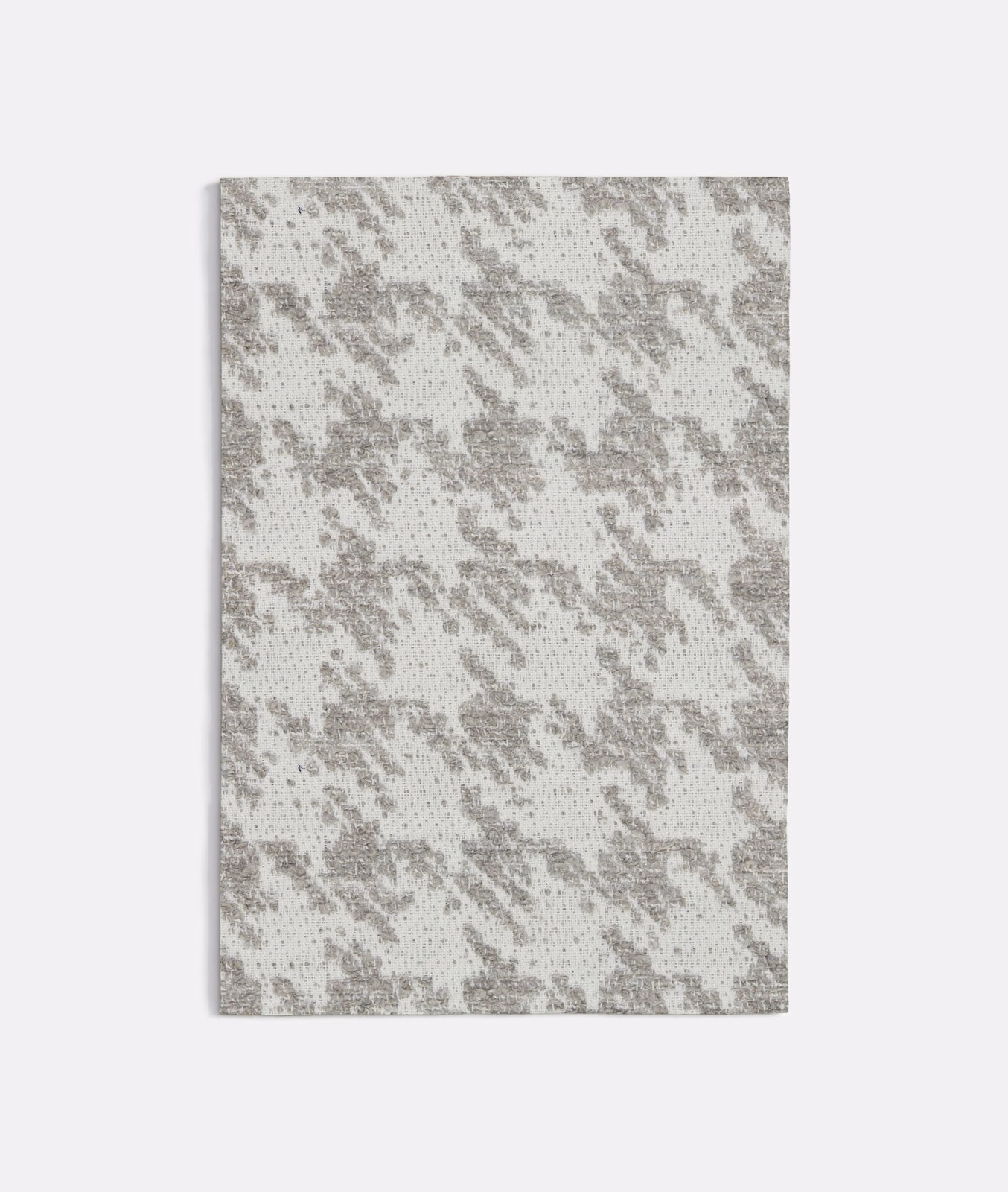 Cool grey woven pied-de-poule with broken darker checks and a pale ground
