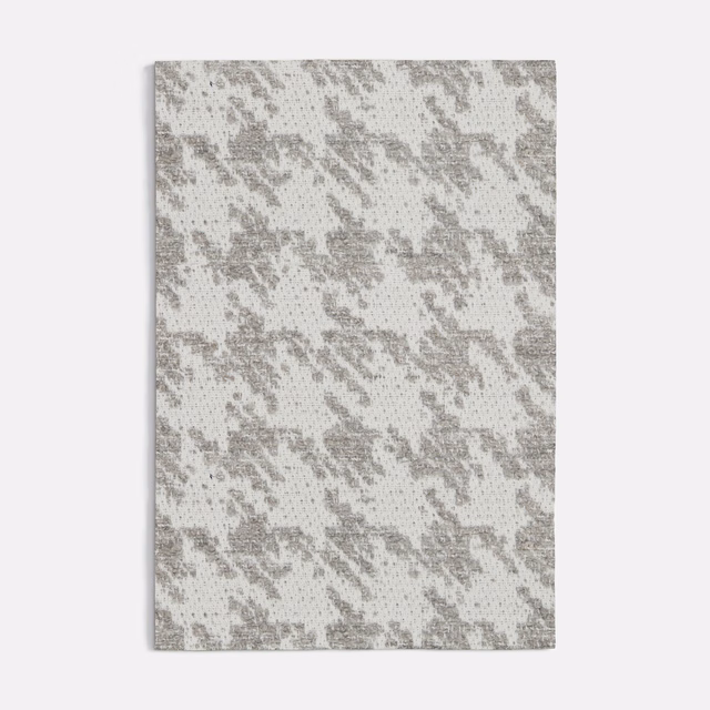 Cool grey woven pied-de-poule with broken darker checks and a pale ground