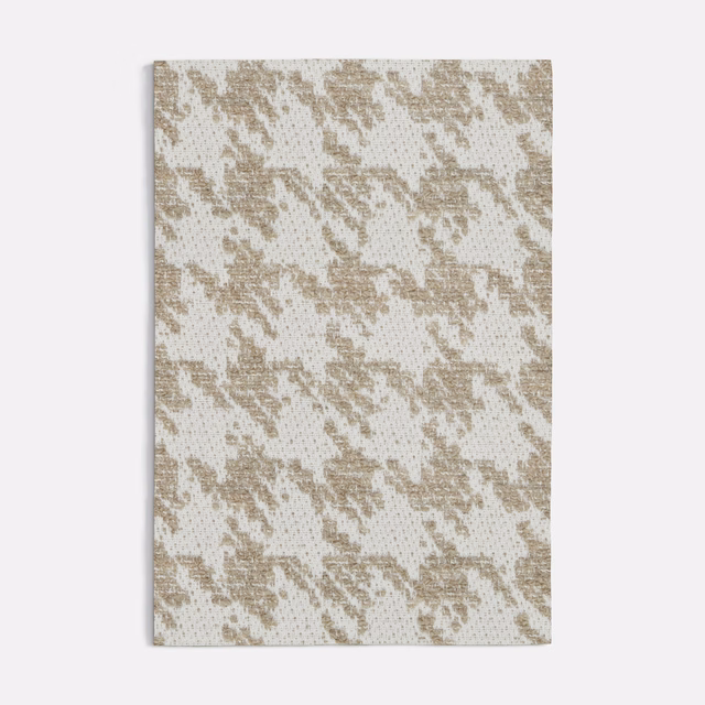 Warm beige houndstooth weave on an ivory textured fabric swatch