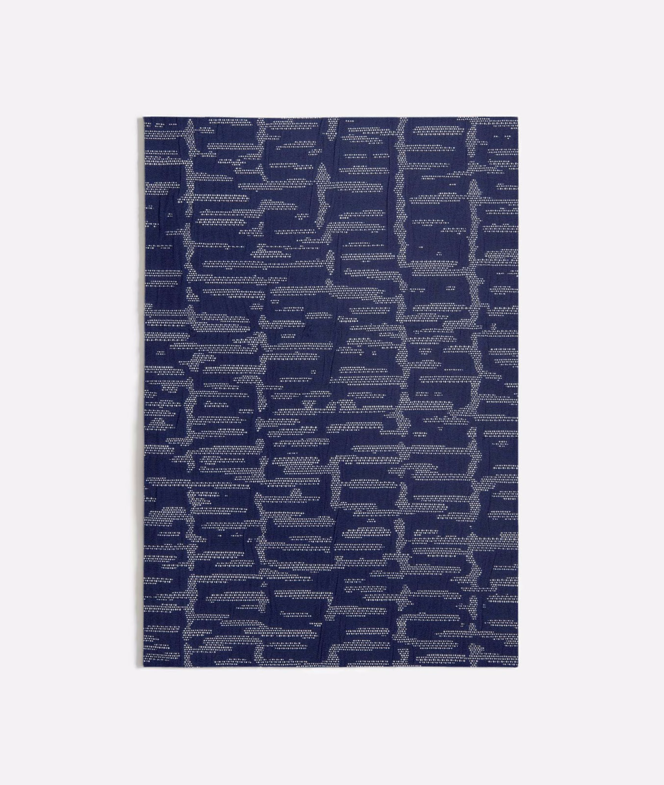 Deep indigo-blue woven swatch with broken blue-grey horizontal bars and stepped motifs