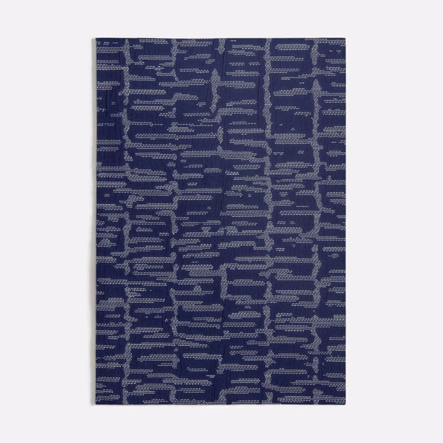 Deep indigo-blue woven swatch with broken blue-grey horizontal bars and stepped motifs