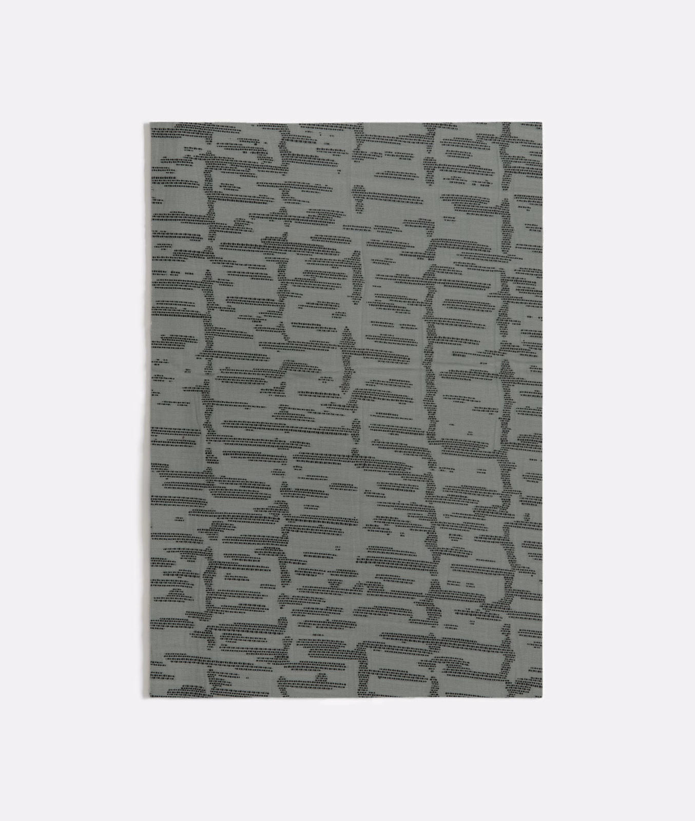 Muted seafoam textile with charcoal-grey broken maze-like woven lines