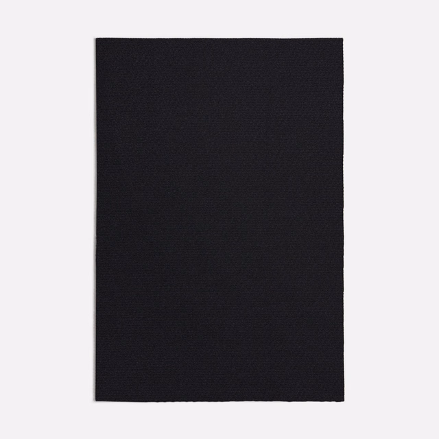 Near-black Quercia swatch showing a fine, subtly textured woven surface