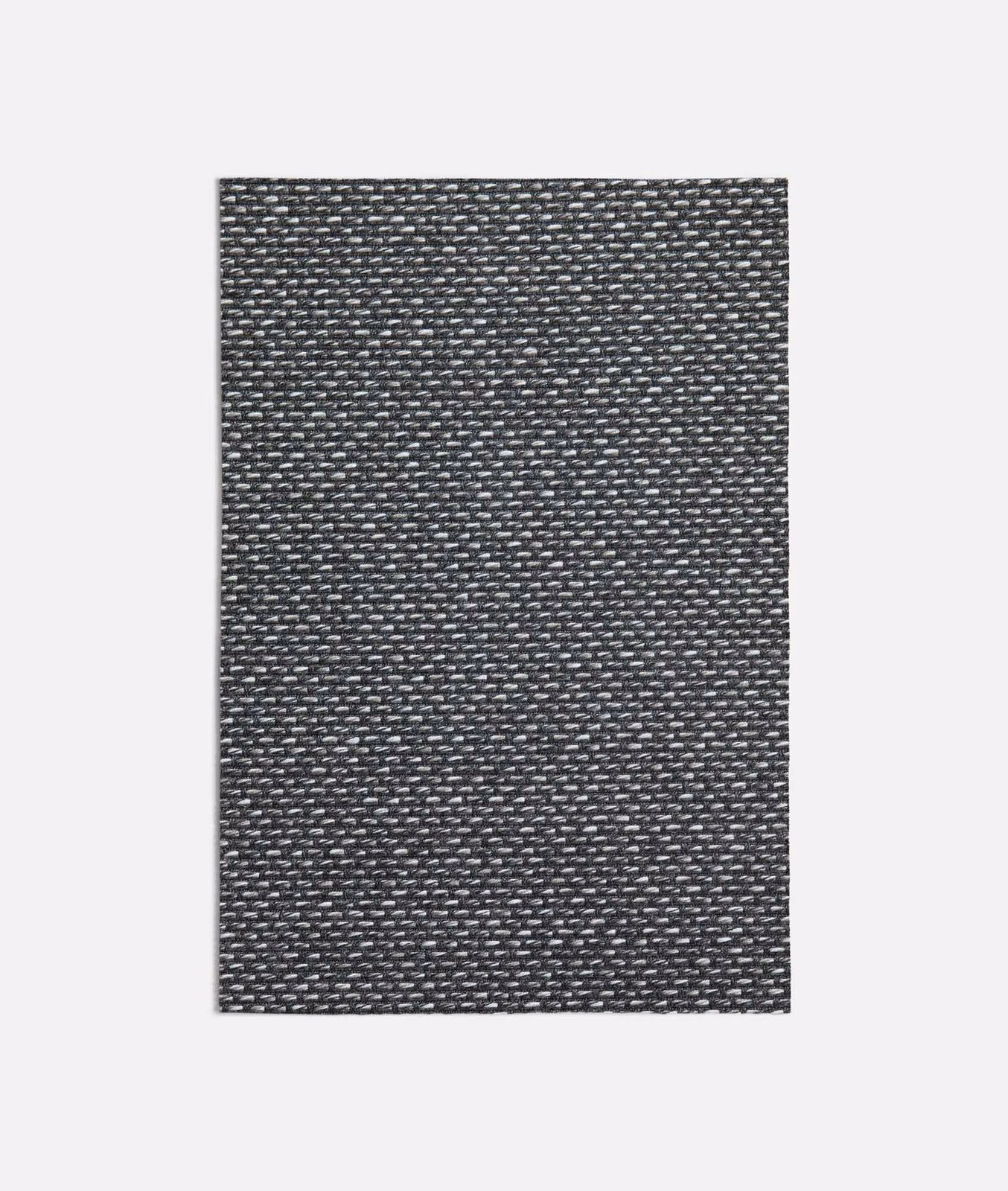 Close view of charcoal-grey woven textile with fine silver-grey flecks